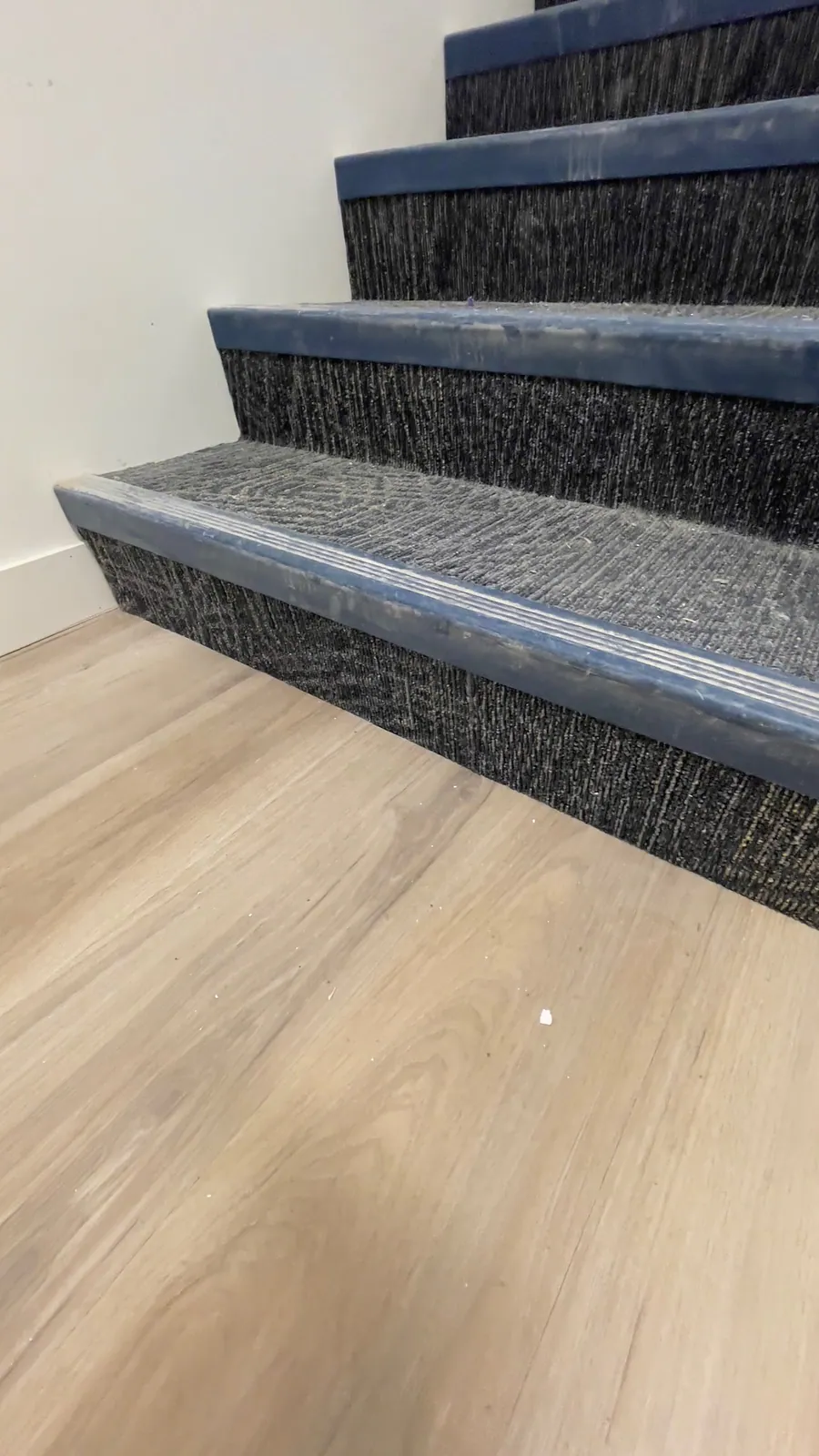 Additional view of a finished dark tiled staircase